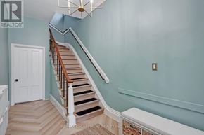 Hamilton (Central) apartment for rent - A staircase with a light blue wall and wooden steps.