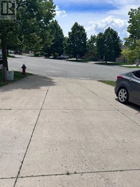 Niagara Falls (Mt. Carmel) apartment for rent - A car is parked on the side of a street.