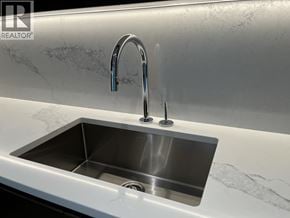 North Vancouver apartment for rent - A modern kitchen sink with a chrome faucet.