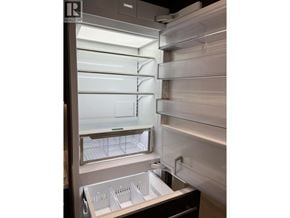 North Vancouver apartment for rent - A stainless steel refrigerator with a drawer and shelves.