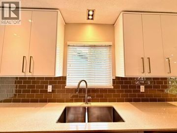 North Vancouver apartment for rent - A kitchen with a sink and cabinets.