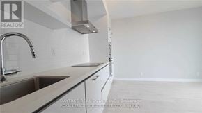 Toronto (Mount Pleasant West) condo for rent - A kitchen with a sink and a stove top oven.