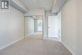 Toronto (Mount Pleasant West) condo for rent - A real estate listing image of a room with a carpeted floor and a sliding glass door.