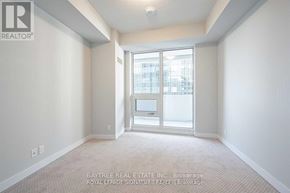 Toronto (Mount Pleasant West) condo for rent - A room with a large window and a carpeted floor.
