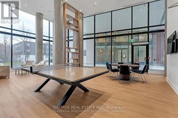 Toronto (Downsview-Roding-Cfb) condo for rent - A modern living room with a large table and chairs.