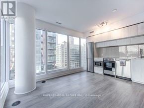 Toronto (Moss Park) condo for rent - A spacious kitchen with a view of the city.