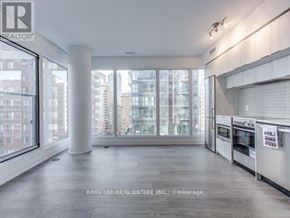 Toronto (Moss Park) condo for rent - A spacious kitchen with a view of the city.