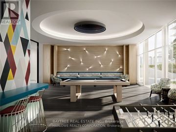Toronto (Waterfront Communities) condo for rent - A modern living room with a pool table and a large window.
