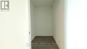 Vaughan (Vaughan Corporate Centre) condo for rent - A white room with a realtor logo on the top left.