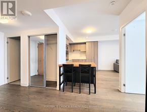 Toronto (Bay Street Corridor) condo for rent - A dining area with a table and chairs is shown in the image.