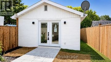 Belleville (Belleville Ward) apartment for rent - A small white house with a satellite dish on the roof.