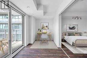 Toronto (Niagara) condo for rent - A room with a bed, desk, and chair is shown.