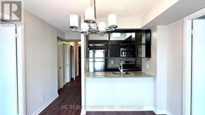 Toronto (Agincourt South-Malvern West) condo for rent - A kitchen with a granite countertop and a fridge.