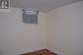 Toronto (Milliken) apartment for rent - A room with a window covered by a curtain.