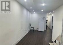 Toronto (Oakridge) apartment for rent - A room with a chair and a cabinet in it.
