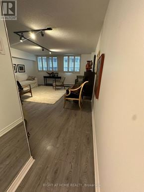 Toronto (Rosedale-Moore Park) condo for rent - A living room with a couch, chair, and a piano.