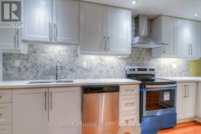 Vaughan (Patterson) apartment for rent - A kitchen with a stove top oven and a dishwasher.