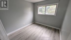 Toronto (Humber Summit) apartment for rent - A room with a window and wooden flooring.