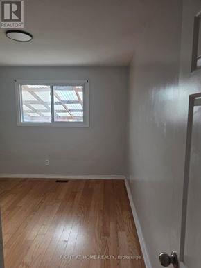 Toronto (Humber Summit) apartment for rent - A room with a window and wooden flooring.