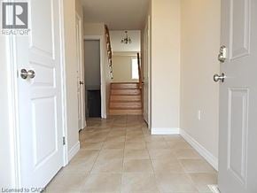 Hannon townhouse for rent - A hallway with a staircase leading to the second floor.