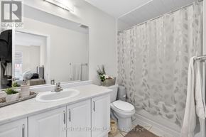 Brantford apartment for rent - A bathroom with a sink, toilet, and shower.