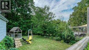 Cambridge apartment for rent - A backyard with a wooden deck and a play structure.