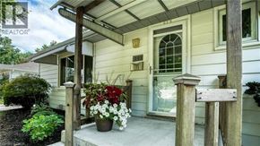 Cambridge apartment for rent - A house with a porch and a sign that says "REALTOR".