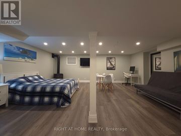 Mississauga (Rathwood) apartment for rent - A bedroom with two beds and a couch.