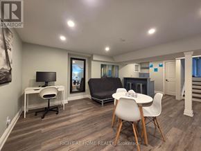 Mississauga (Rathwood) apartment for rent - A well-lit room with a desk, chairs, and a couch.