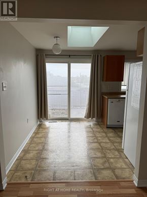 Barrie (Georgian Drive) apartment for rent - A room with a tiled floor and a window with blinds.