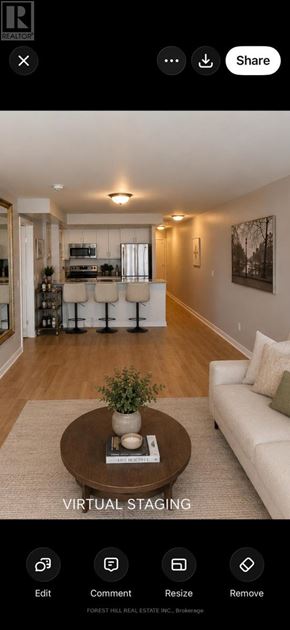 Toronto (Waterfront Communities) condo for rent - A living room with a couch, coffee table, and a plant on the table.