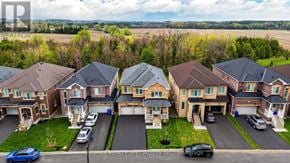Shelburne apartment for rent - A row of houses with cars parked in front.