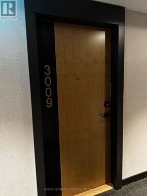 Vaughan (Concord) condo for rent - A brown door with the number 3009 on it.