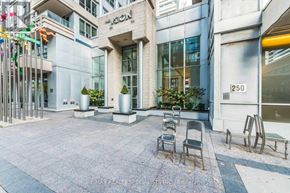 Toronto (Waterfront Communities) condo for rent - A courtyard with chairs and a building with the number 250 on it.