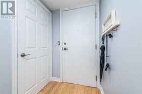 Toronto (Waterfront Communities) condo for rent - A white door is closed with a black handle and a small white sign on the wall above it.
