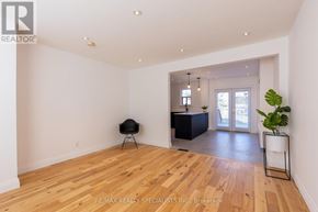 Toronto (Stonegate-Queensway) apartment for rent - A room with wooden flooring and a black chair.