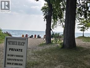 Colchester apartment for rent - A sign on a beach reads "Seymour Beach Private" and instructs to clean up after pets and swim at own risk.