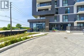 Oakville (Jm Joshua Meadows) condo for rent - A modern building with the number 345 on it.
