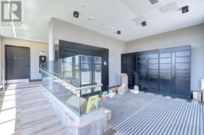 Oakville (Jm Joshua Meadows) condo for rent - A room with a glass display case in the middle of it.
