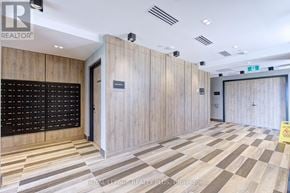 Oakville (Jm Joshua Meadows) condo for rent - A hallway with wood paneling and a checkerboard floor.