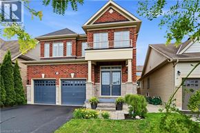 Niagara-On-The-Lake apartment for rent - A two-story house with a brick facade and a large front yard.