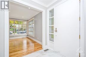 Ottawa apartment for rent - A room with a door and a window with a view of a parking lot.