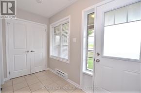 Milton (Sc Scott) townhouse for rent - A white door is on the left and a window with blinds is on the right.