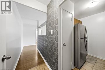 Scarborough apartment for rent - A modern kitchen with a refrigerator and a patterned backsplash.