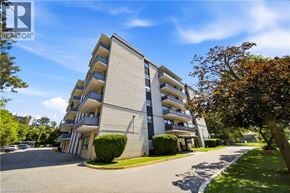 Scarborough apartment for rent - A tall apartment building with balconies on the second floor.