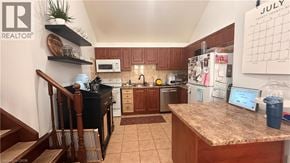 Hamilton apartment for rent - A kitchen with a counter top and a calendar on the wall.