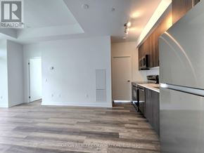 Pickering (Bay Ridges) condo for rent - A kitchen area with a stainless steel countertop and wooden flooring.