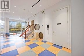 Toronto (Clanton Park) condo for rent - A hallway with a checkered floor and a white door.