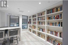 Toronto (Clanton Park) condo for rent - A bookshelf filled with books in a room.