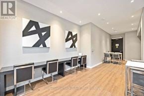 Toronto (Clanton Park) condo for rent - A realtor office with a row of chairs and two large X's on the wall.
